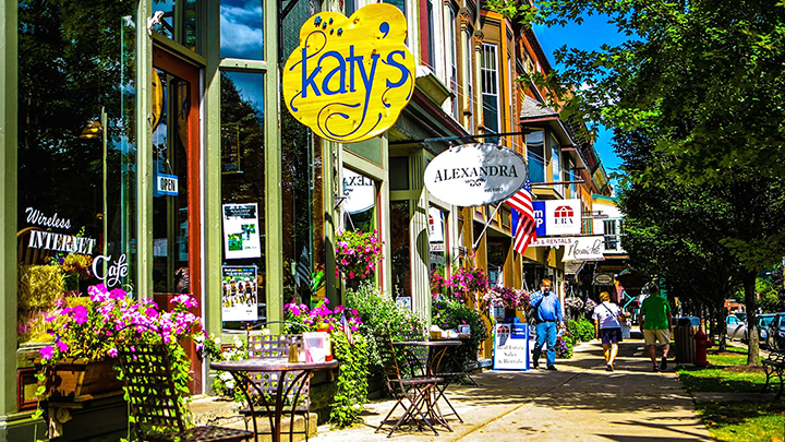 a bright yellow sign the says Katy's hanging in front of Katy's cafe in Ellicottville
